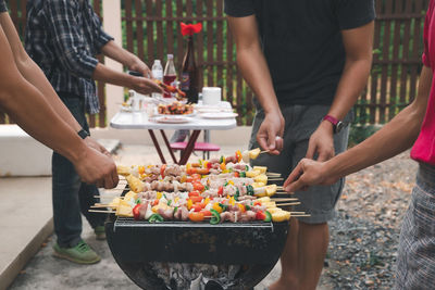 People preparing food outdoors