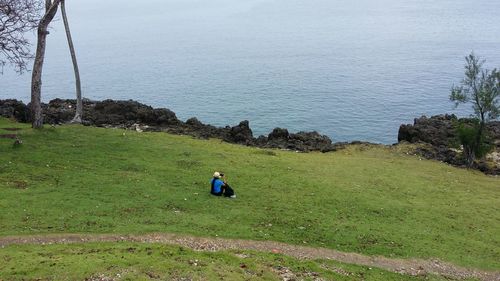 Rear view of man on landscape against sky