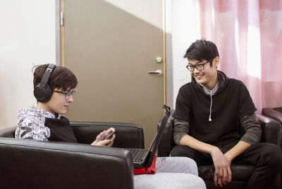 Teenage boys sitting together