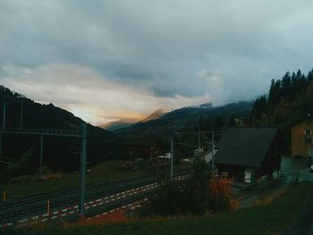 Scenic view of mountains against cloudy sky