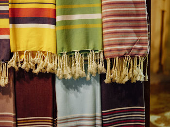 Close-up of multi colored clothes hanging on clothesline