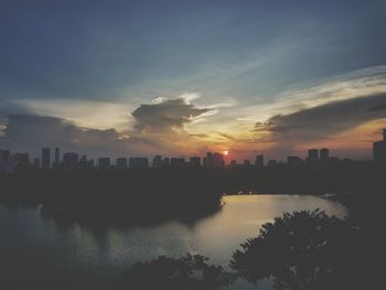 Scenic view of cityscape against sky during sunset