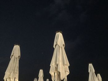 Low angle view of statue against sky at night