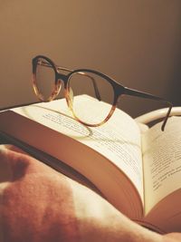 Close-up of eyeglasses on book