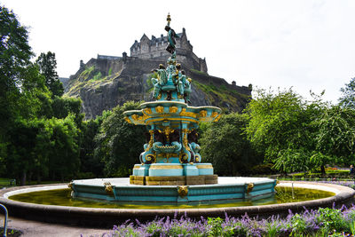 Low angle view of statue against trees