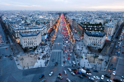 High angle view of busy street amidst buildings in city