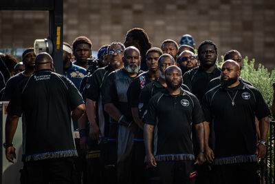Group of people standing in a row