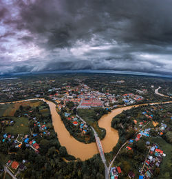 Aerial view of cityscape against sky