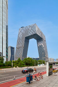 View of modern building against clear blue sky