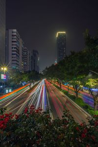 High angle view of light trails on road at night