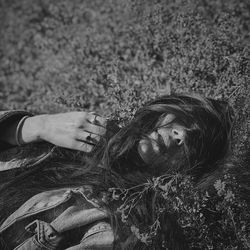 High angle view of woman lying on land