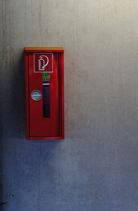 Close-up of red box on wall