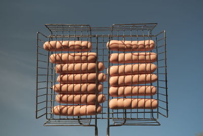 High angle view of barbecue grill against blue background