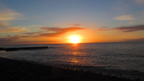 Scenic view of sunset over sea