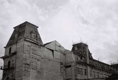 Low angle view of old building against sky