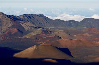 Scenic view of volcanic mountains against sky