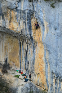 Rear view of people on rock