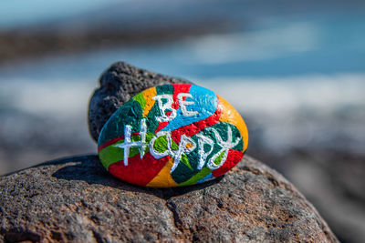 Close-up of multi colored rock on sea shore