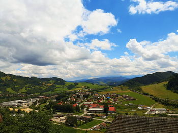 High angle view of houses and buildings against sky