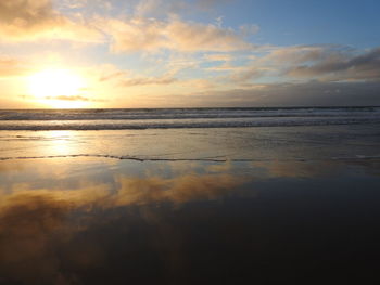 Scenic view of sea against sky during sunset