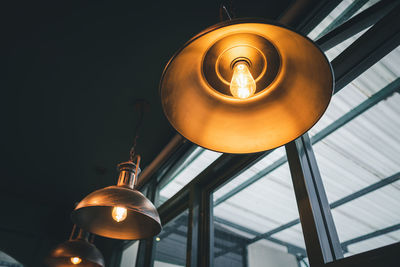 Low angle view of illuminated light bulb