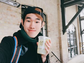 Portrait of boy drinking coffee