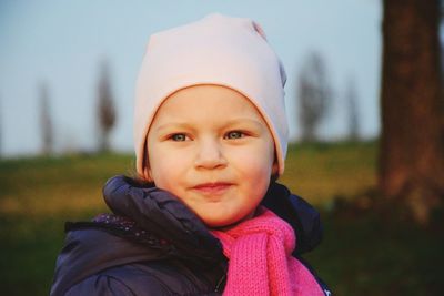 Smiling cute girl wearing warm clothing during winter