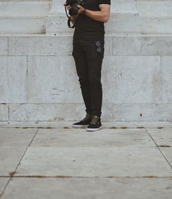 Low section of man standing on floor