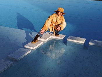 Low angle view of man walking on snow