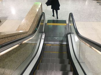 Low section of man walking on steps