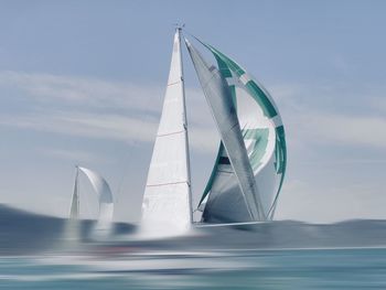 Scenic view of sailboat against sky