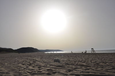 Scenic view of beach against sky during sunset