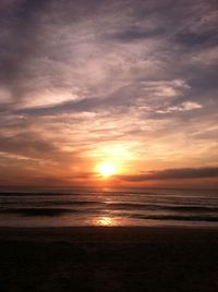 View of beach at sunset