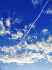 Low angle view of vapor trail in sky