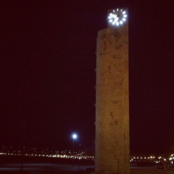 night, illuminated, architecture, built structure, clear sky, dark, copy space, bridge - man made structure, building exterior, connection, architectural column, low angle view, engineering, outdoors, city, lighting equipment, bridge, sky, moon, light - natural phenomenon