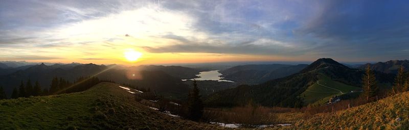 Panoramic view of landscape during sunset against cloudy sky