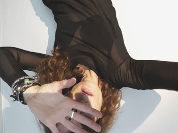 High angle view of mature woman lying on floor