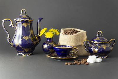 Close-up of various flower on table against black background