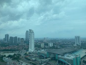 Aerial view of modern buildings in city against sky