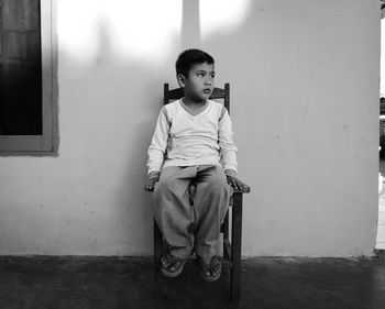 Portrait of boy sitting outdoors