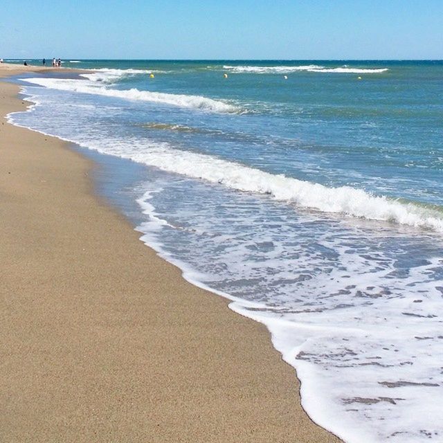 sea, beach, horizon over water, water, shore, sand, wave, surf, scenics, tranquility, tranquil scene, beauty in nature, nature, blue, clear sky, coastline, idyllic, sky, summer, vacations