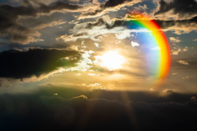 Low angle view of rainbow in sky during sunset