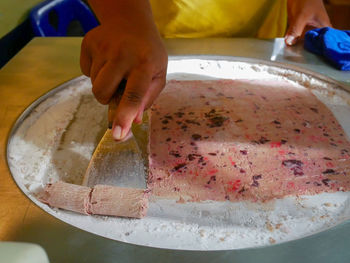Close-up of person preparing food