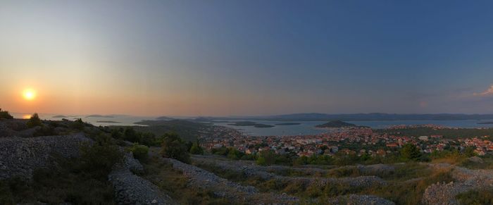 Scenic view of landscape against sky during sunset