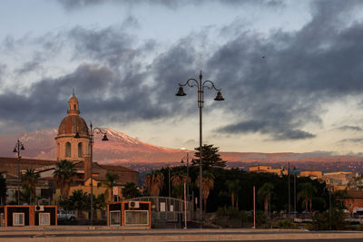 Low angle view of buildings against sky during sunset