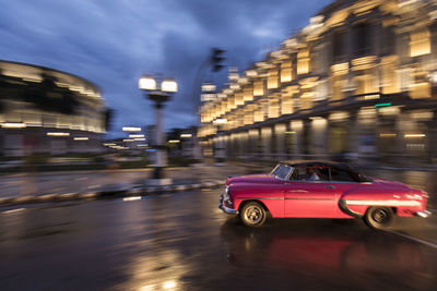 Blurred motion of car on road at night