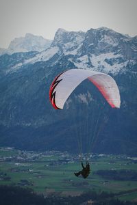 Low angle view of hot air balloon over mountain landscape