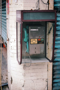 Old telephone mounted on wall