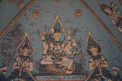 High angle view of sculptures on ceiling in temple building