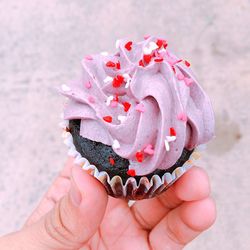 Cropped hand holding ice cream